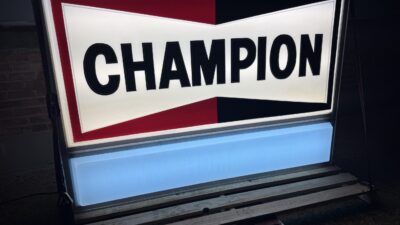Illuminated Champion Spark Plug Sign